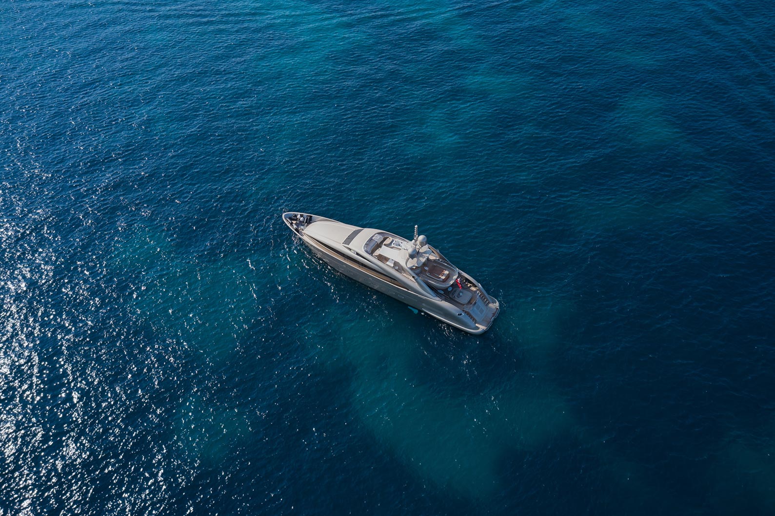 An image of a yacht sailing in sea.