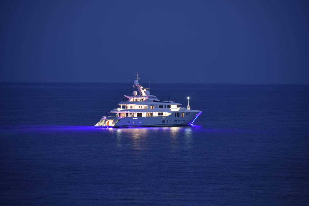 An image of a yacht sailing in sea.