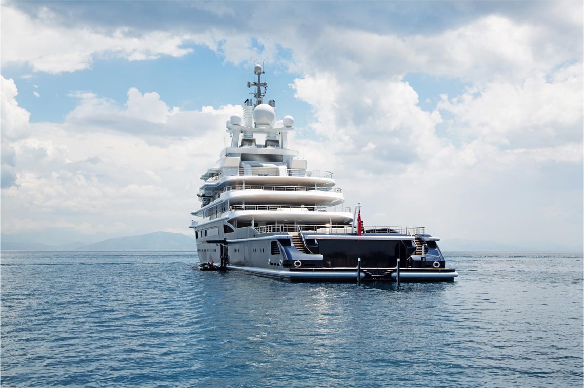 An image of a yacht sailing in sea.