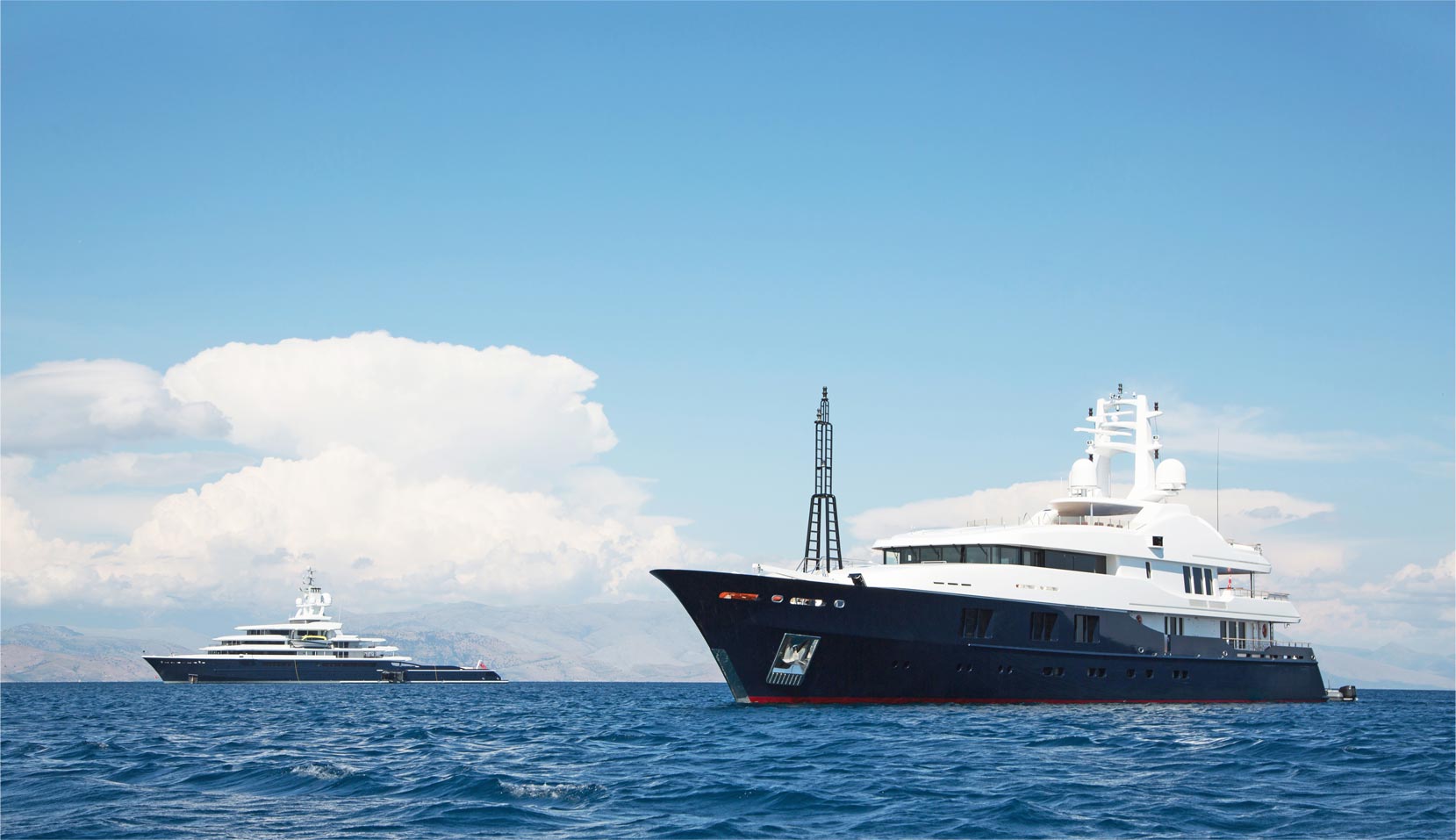 An image of a yacht sailing in sea.